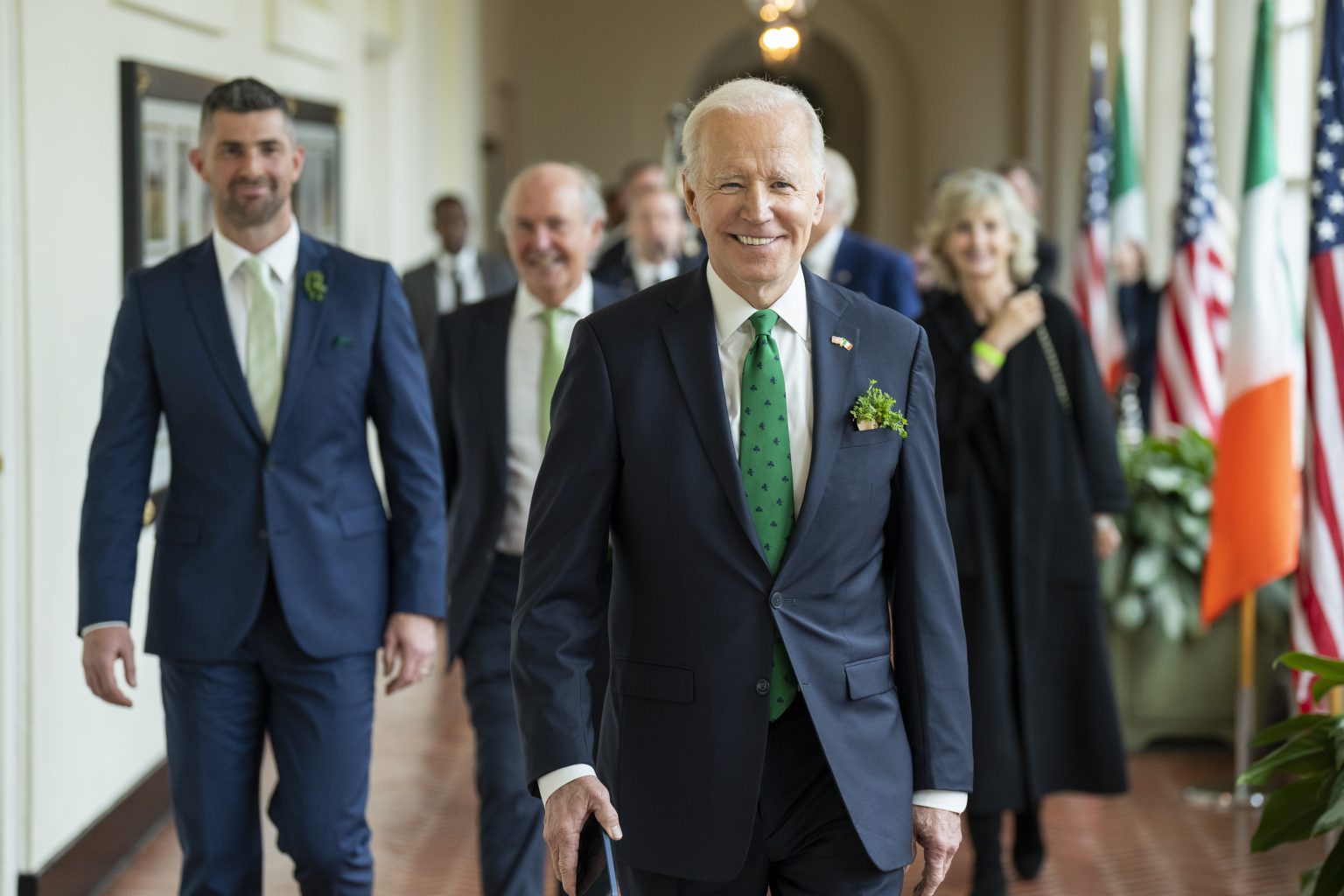 President Joe Biden walks through the East Colonnade during a tour with Irish Rugby player Rob Kearney and his guests, Thursday, March 17, 2022, at the White House. (Official White House Photo by Adam Schultz)