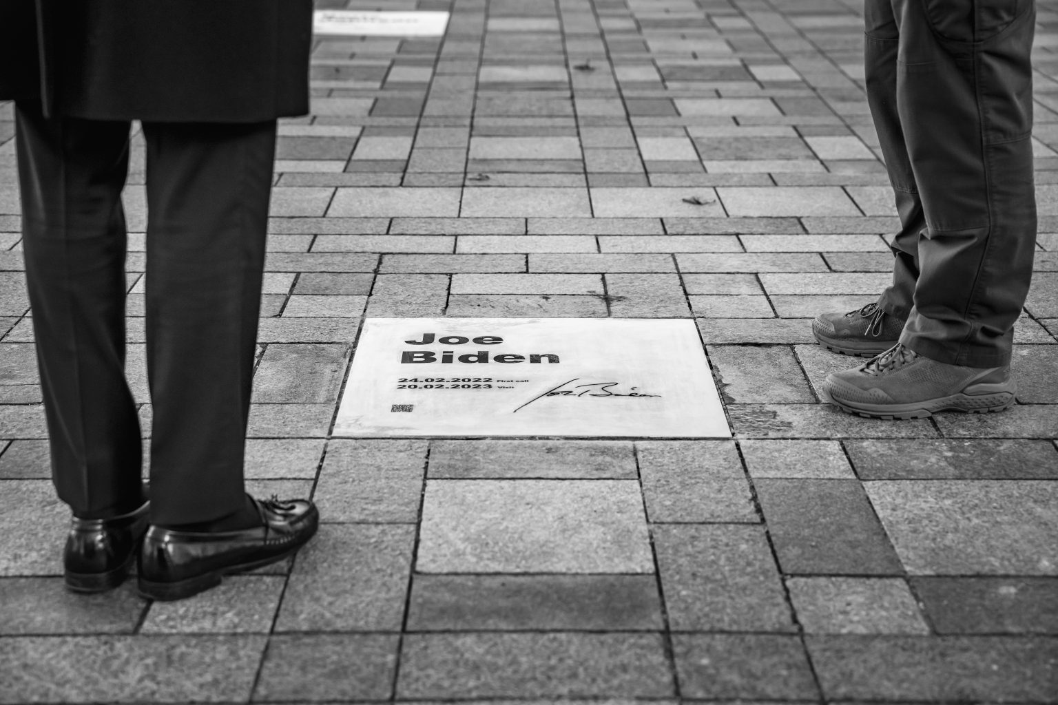 President Joe Biden views the Walk of the Brave with Ukrainian President Volodymyr Zelenskyy Monday, February 20, 2023, at the Mariyinskyy Palace in Kyiv, Ukraine. The "Walk of the Brave" name plates honor those who have helped in the struggle against the Russian invasion of Ukraine. (Official White House Photo by Adam Schultz)