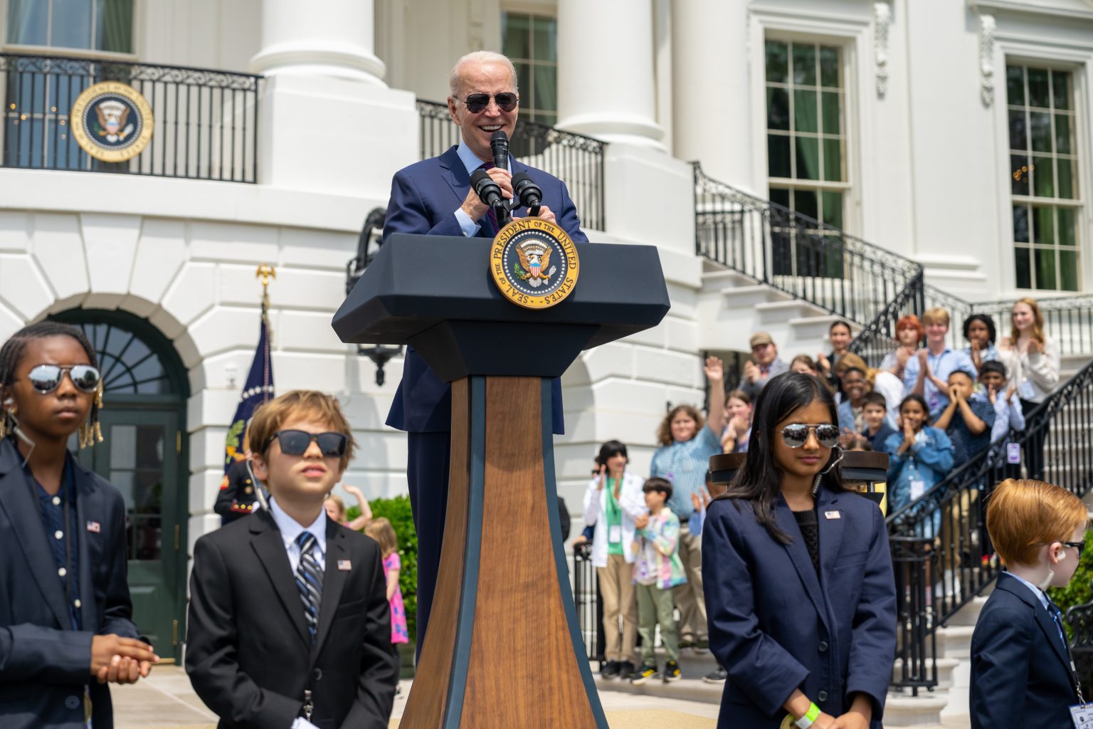 President Joe Biden addresses parents and children participating in “Bring Your Child to Work Day”, Thursday, April 27, 2023, at the South Portico of the White House. Children of staff members are dressed as Secret Service agents. (Official White House Photo by Adam Schultz)