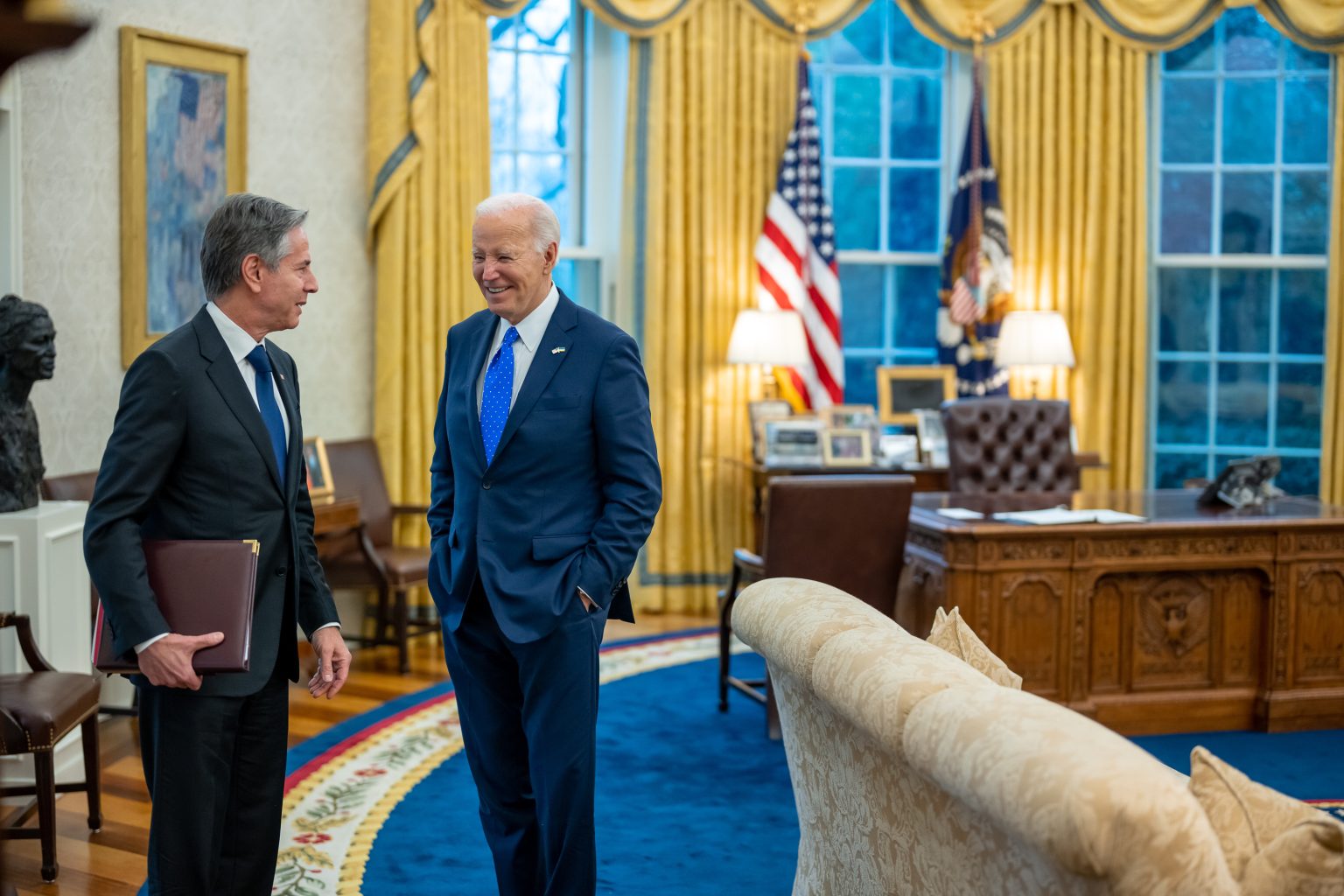 President Joe Biden talks with Secretary of State Antony Blinken after a bilateral meeting with Chancellor Olaf Scholz of Germany, Friday, February 9, 2024, in the Oval Office. (Official White House Photo by Adam Schultz)