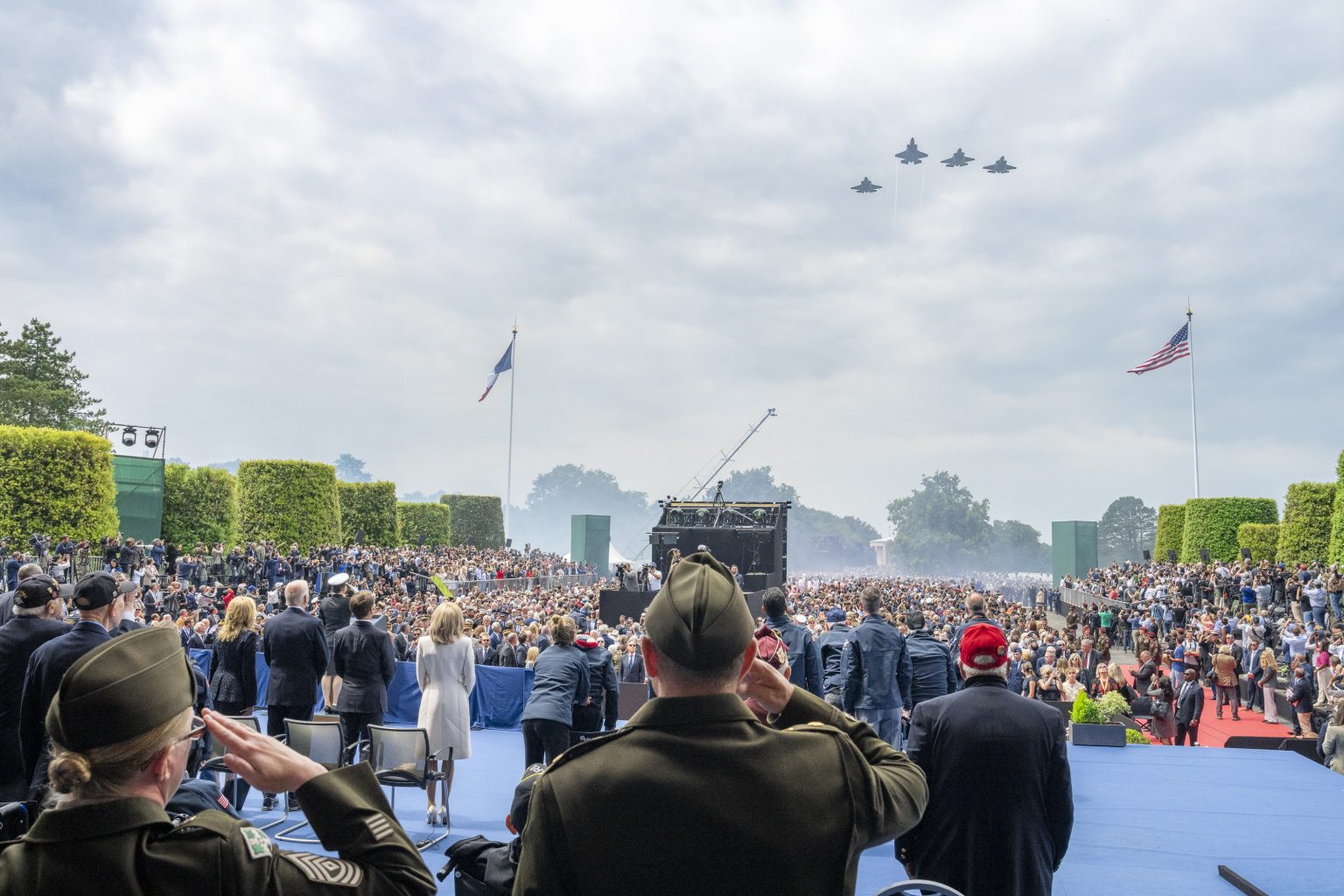 U.S. fighter jets perform a flyover at a ceremony commemorating the 80th anniversary of D-Day, Thursday, June 6, 2024, at the Normandy American Cemetery in Colleville-sur-Mer, France. (Official White House Photo by Adam Schultz)